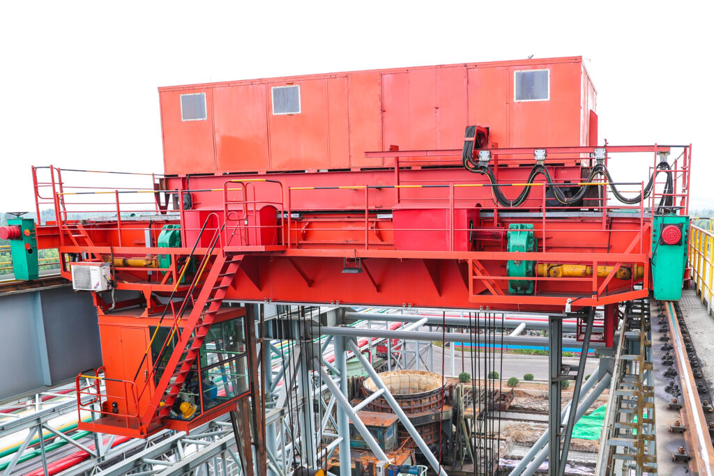 Metallurgical crane above a steelmaking work area, illustrative of the application