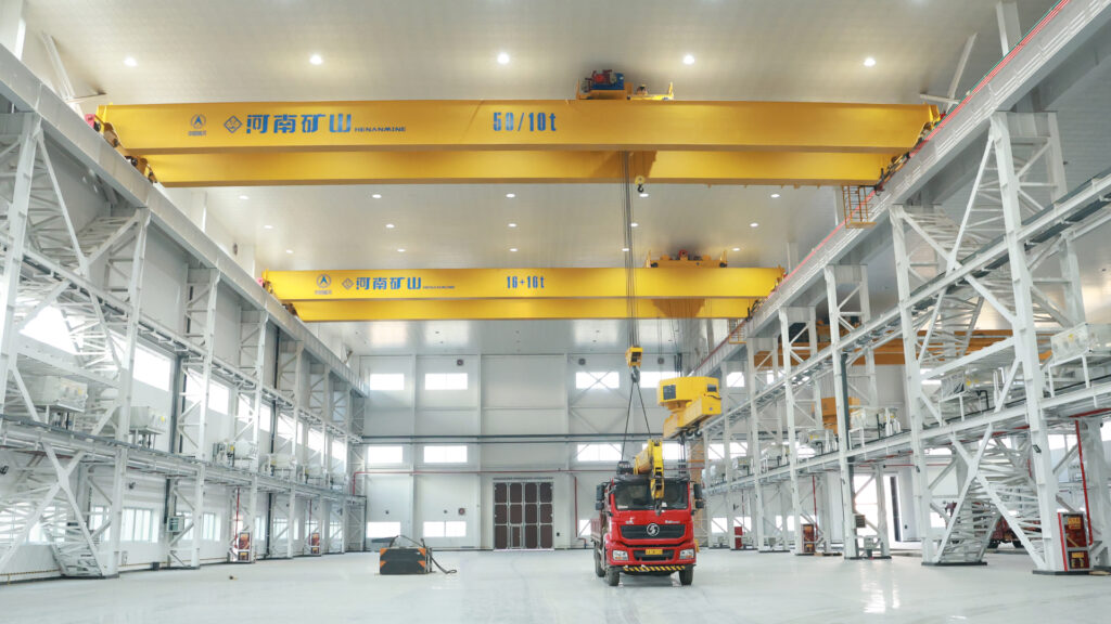 Lower-rotating bridge carrier-beam cranes for aerospace production