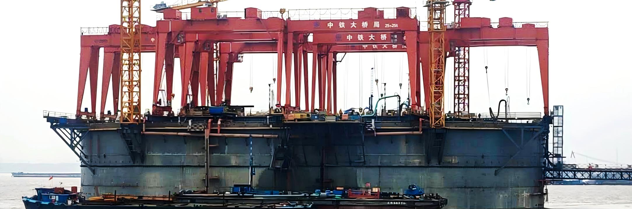 Gantry crane mounted over a bridge caisson construction work area