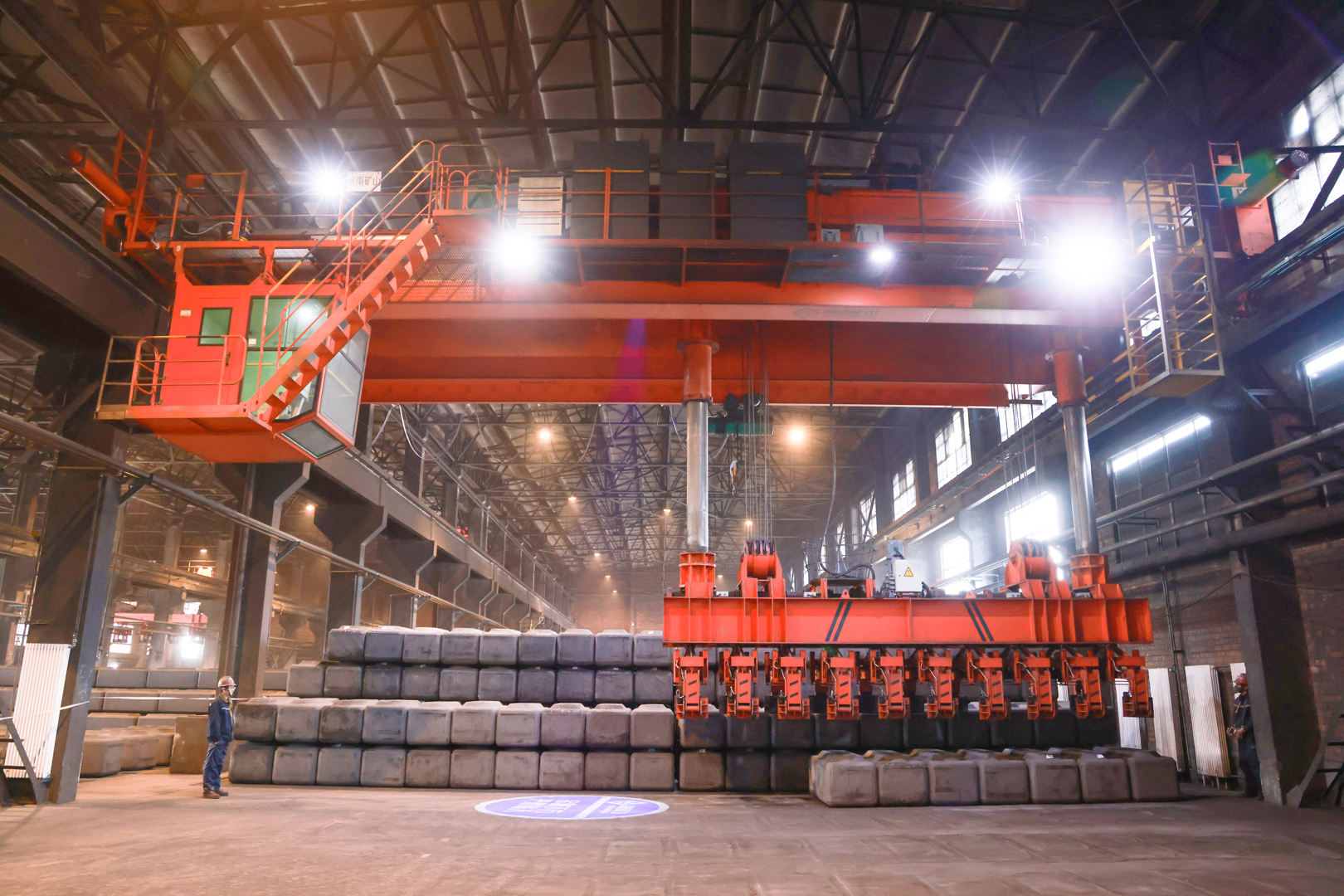Aluminum smelter process crane with suspended handling tools