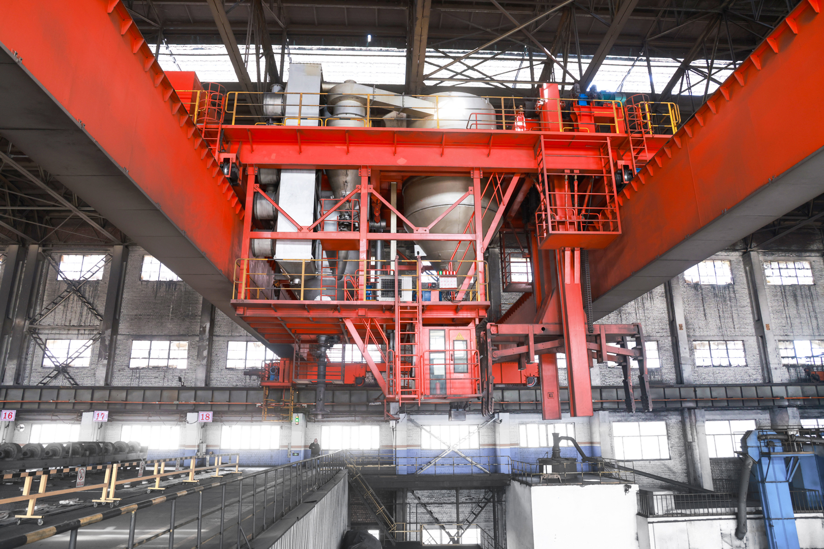 Aluminum smelter process crane with suspended handling tools