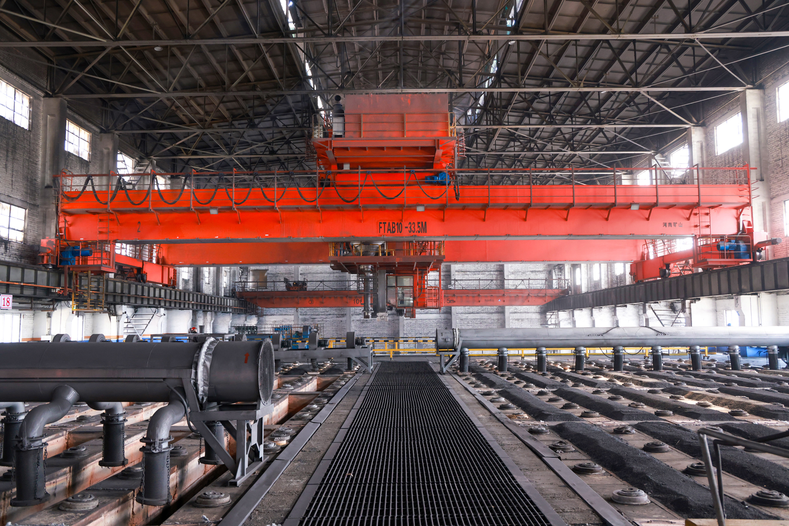 Aluminum smelter process crane with suspended handling tools