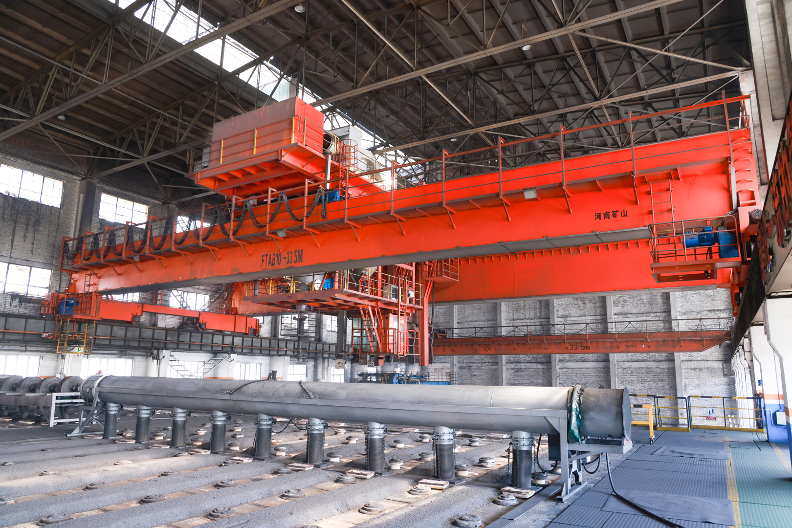 Aluminum smelter process crane with suspended handling tools