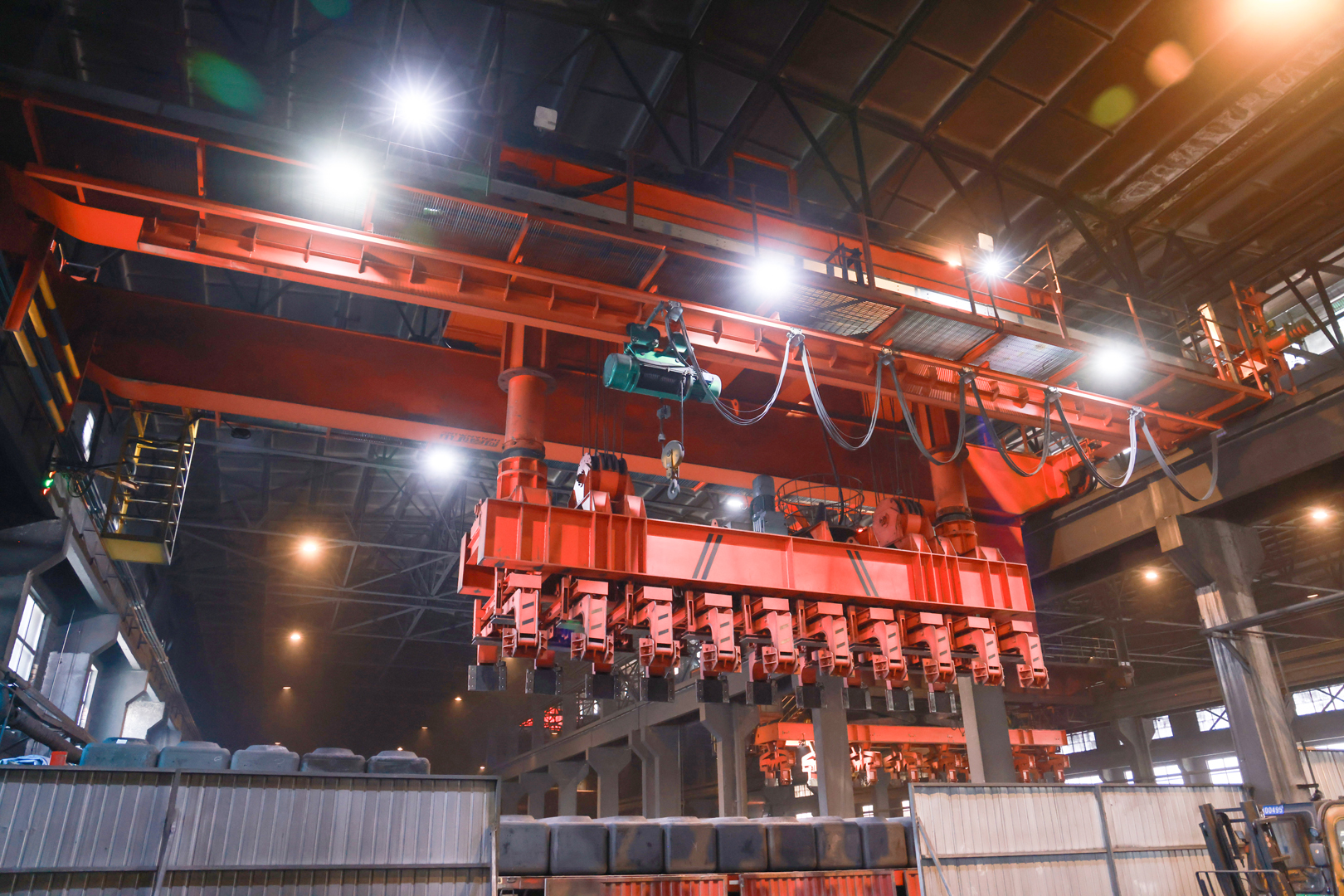 Aluminum smelter process crane with suspended handling tools