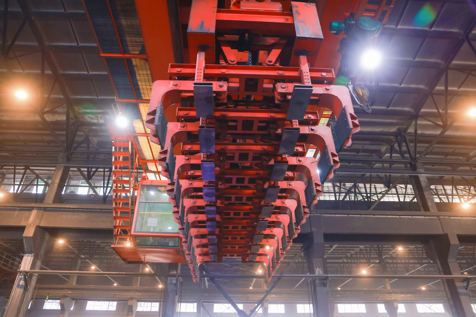 Aluminum smelter process crane with suspended handling tools