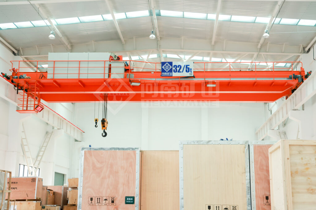 Overhead crane with a 32/5 t capacity marking in an equipment room