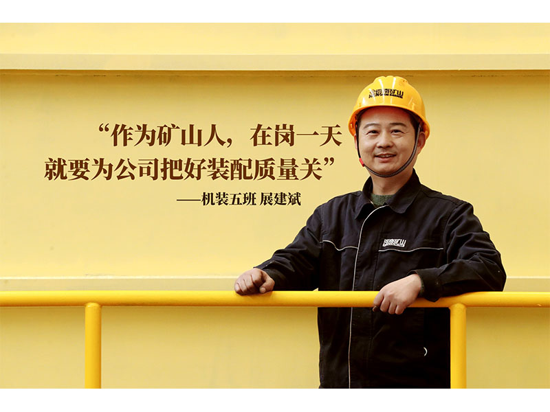 Crane assembly specialist inspecting workshop components