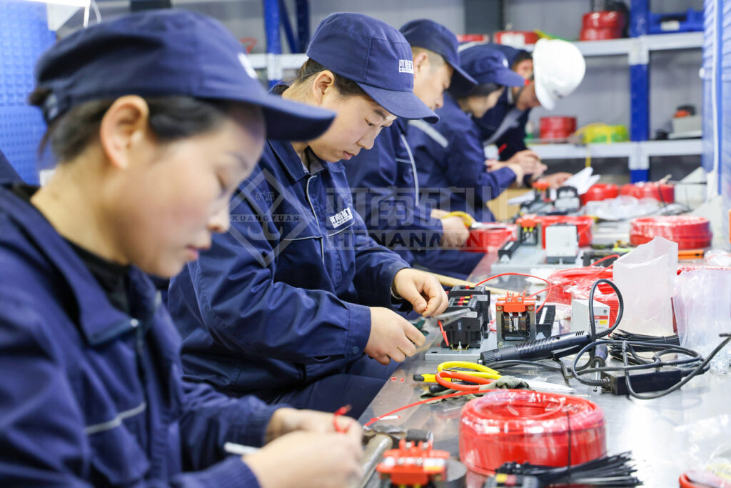 Electrical Assembly Competition Reinforces Crane Control Build Quality — image 4 Electrical assembly skills competition during the factory quality programme
