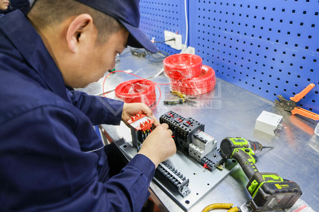 Electrical Assembly Competition Reinforces Crane Control Build Quality — image 5 Electrical assembly skills competition during the factory quality programme