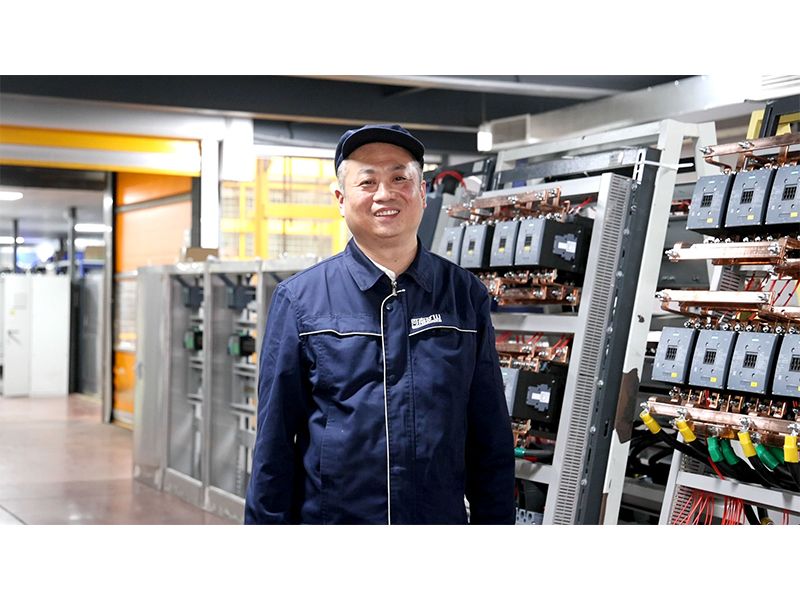 Electrical assembly specialist Fu Dongliang working on crane controls