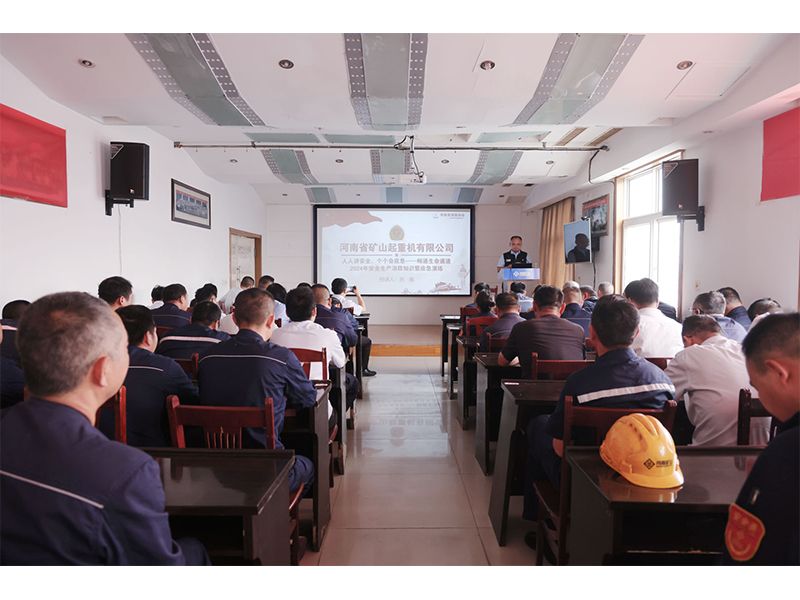 Factory employees participating in fire-safety training and escape practice