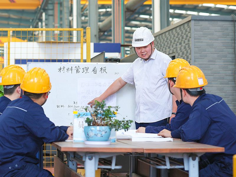 Fu Heng’s electric-hoist assembly team in the manufacturing workshop