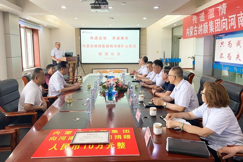 Nashun Group representatives presenting flood-recovery support