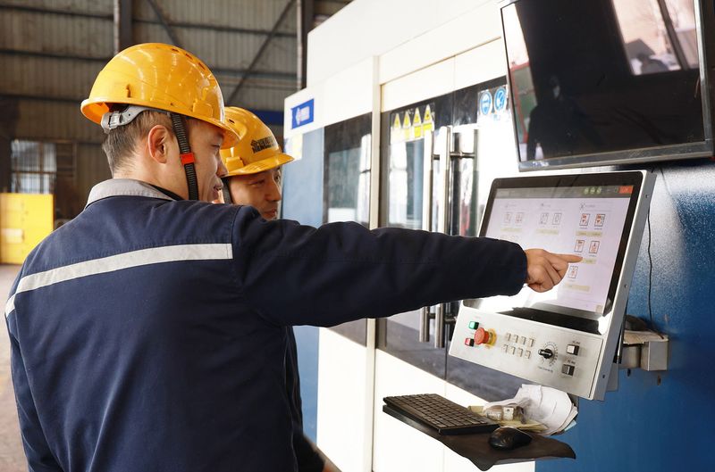 Plasma-cutting specialist Zhao Yufei preparing crane components