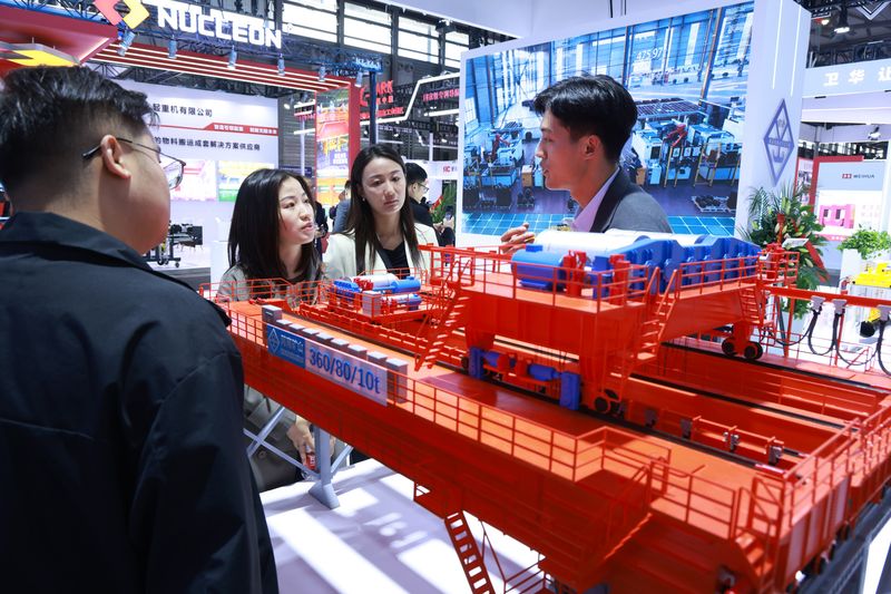 Shanghai Exhibition Displays Automated Industrial Handling Equipment — image 11 Automated industrial crane displays at the Shanghai heavy machinery exhibition