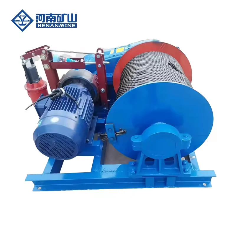 Blue and red base-mounted electric wire rope winch with visible drum, motor and gearbox
