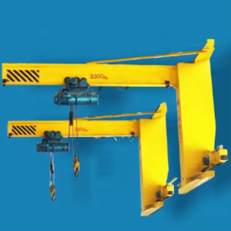 Two wall-side travelling jib arrangements illustrating arm and carriage positions