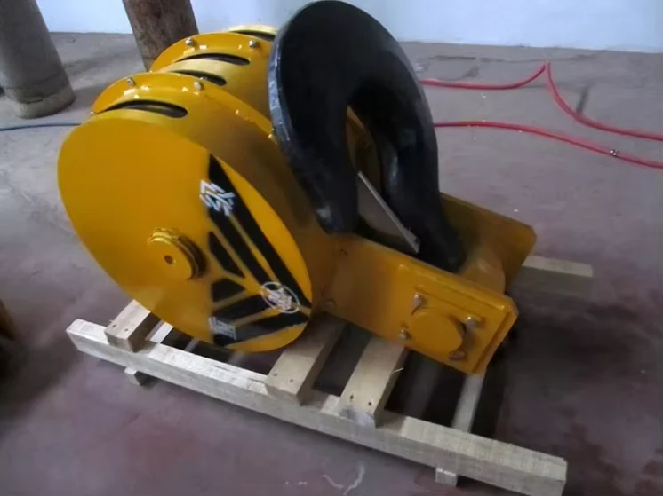 Side view of a yellow hook block and forged hook