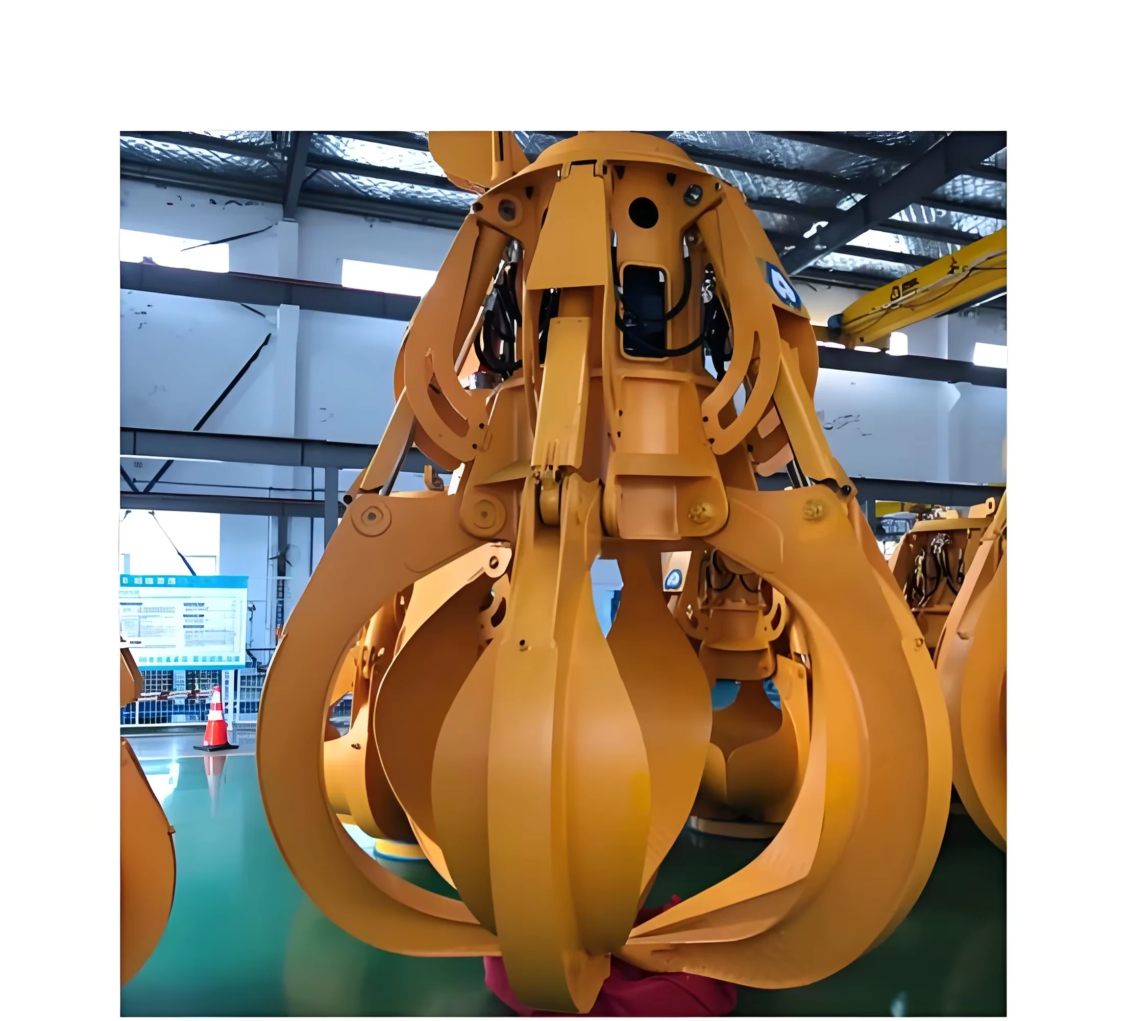 Orange multi-petal grab photographed in a factory