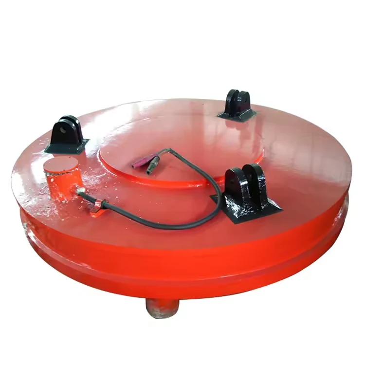 Red circular lifting electromagnet with electrical cable connection and lifting lugs