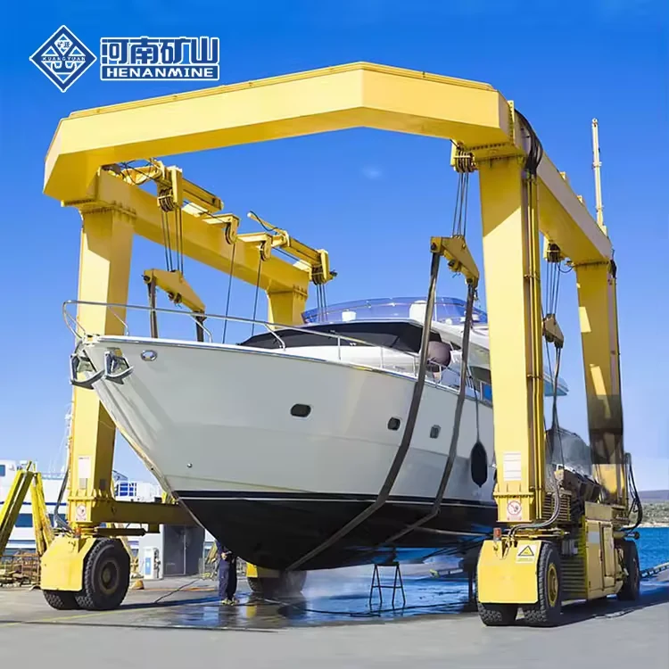 Yellow wheeled marine travel lift holding a white yacht in slings