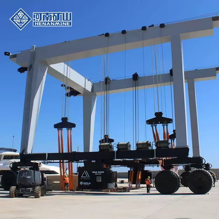 White marine travel lift frame with tyre bogies in a boatyard