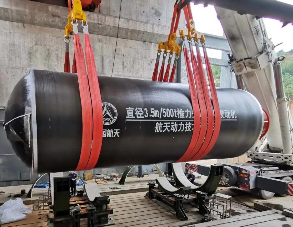 Crane and rigging arrangement for handling a solid rocket motor component