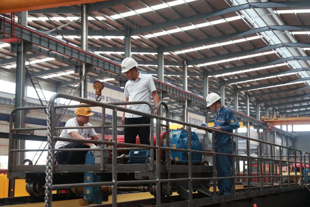 Inspector checking the crane machinery platform and guardrails