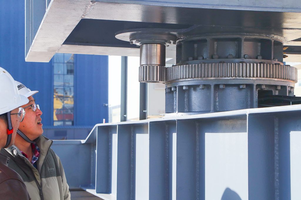 Close-up of the drive assembly on a steel plate handling gantry crane