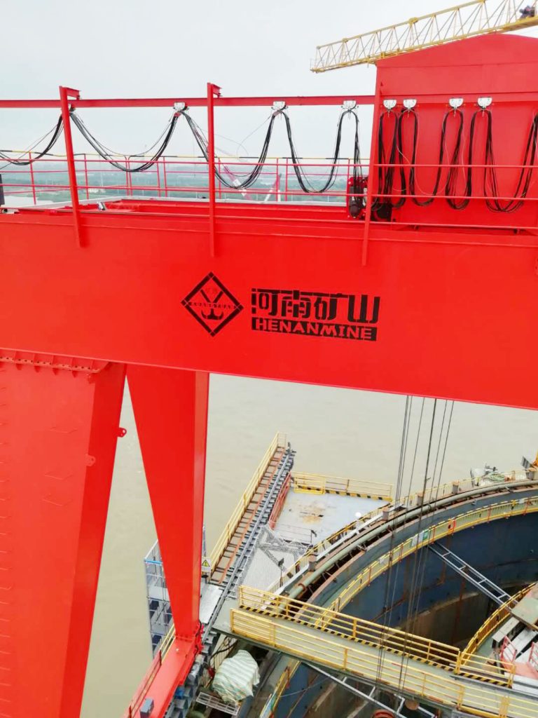 Gantry crane mounted over a bridge caisson construction work area