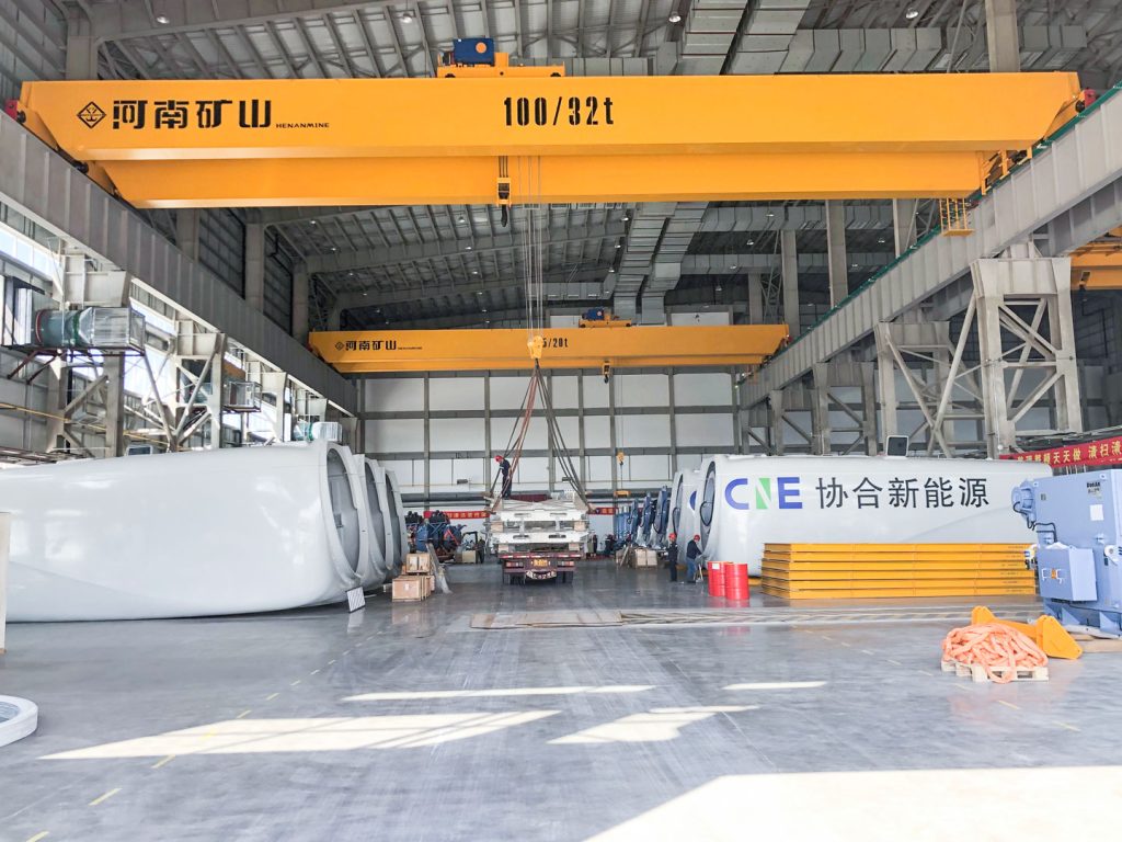Heavy overhead crane serving a wind turbine nacelle production bay