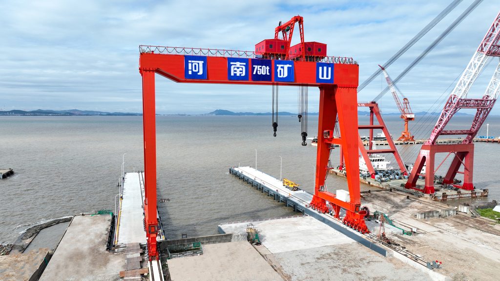 Heavy gantry crane at an outdoor fabrication and assembly site