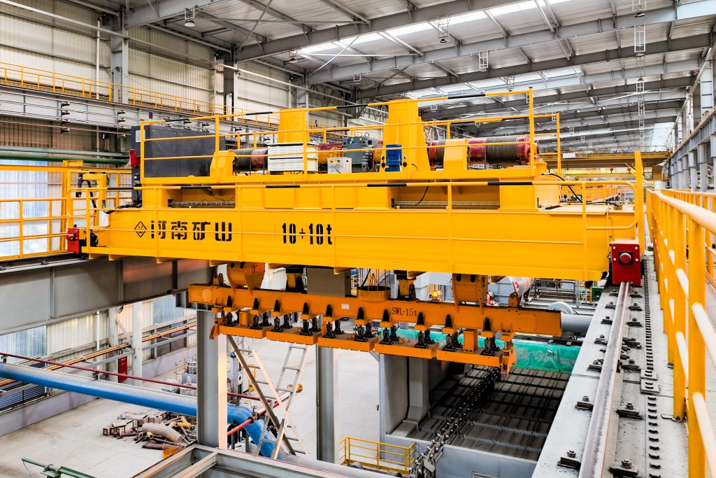 Automated overhead crane with an electro-permanent magnet lifting beam
