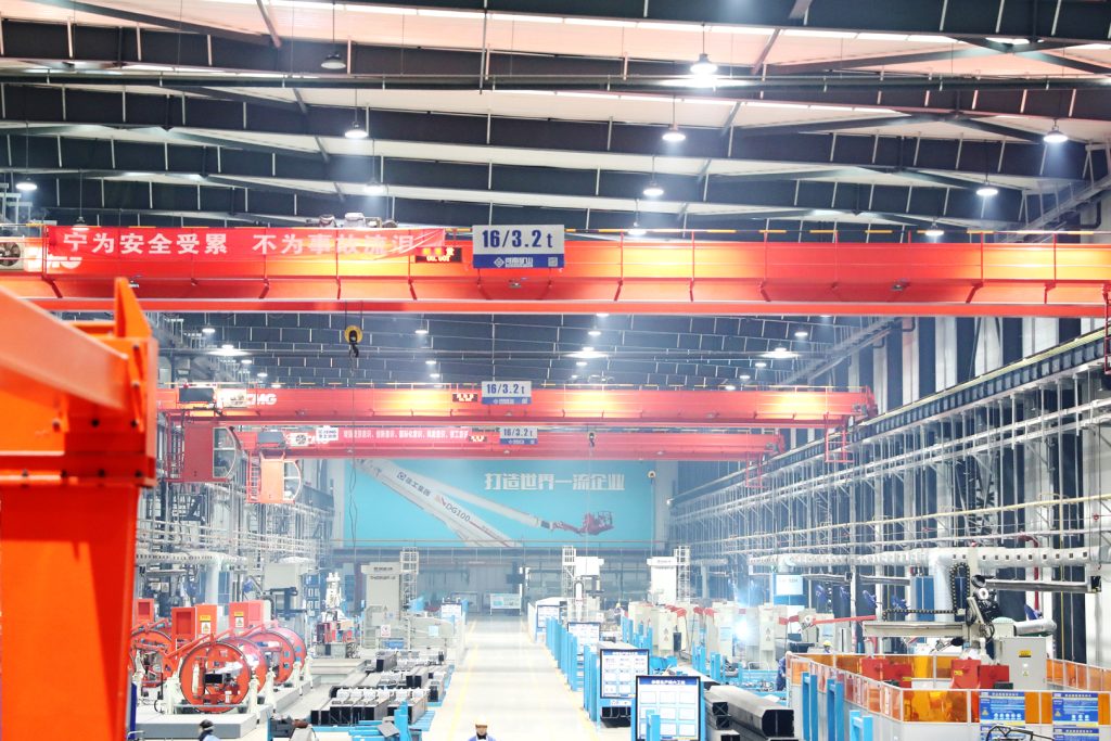 Overhead crane network serving construction machinery production lines