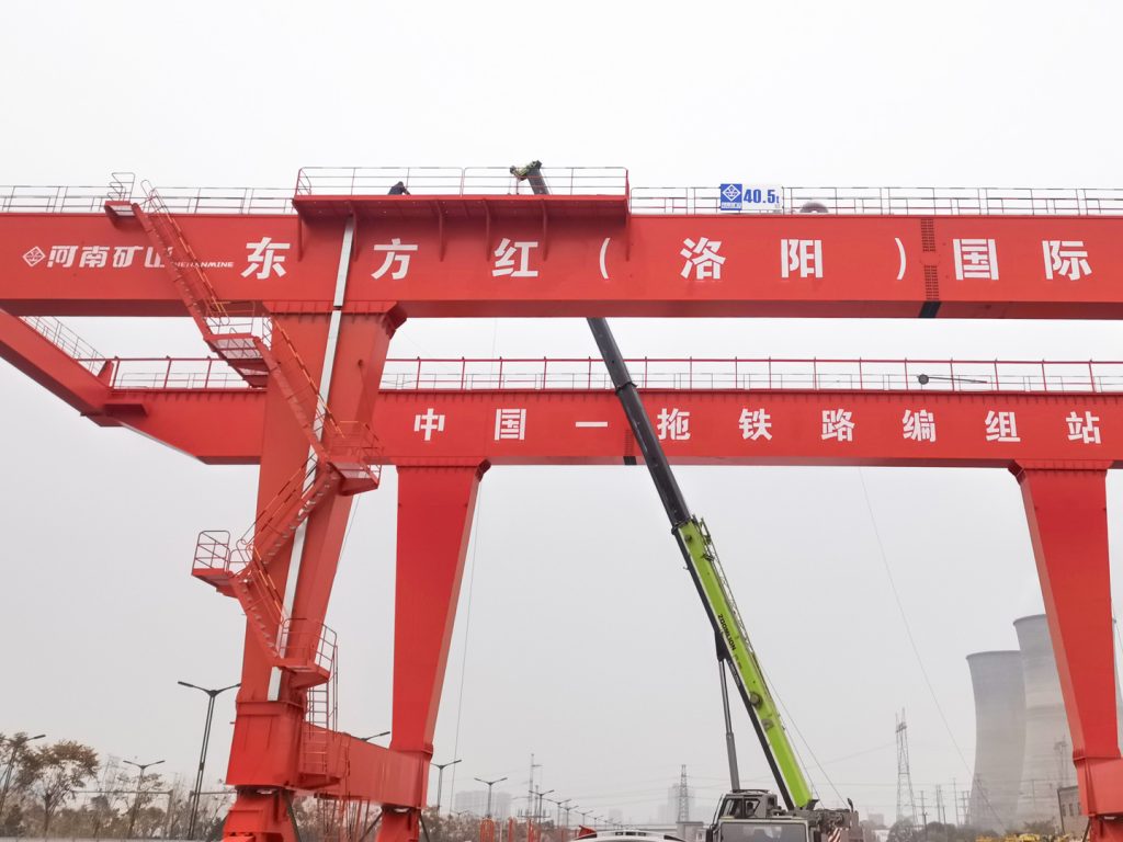 Rail-mounted gantry crane at an inland port cargo transfer site
