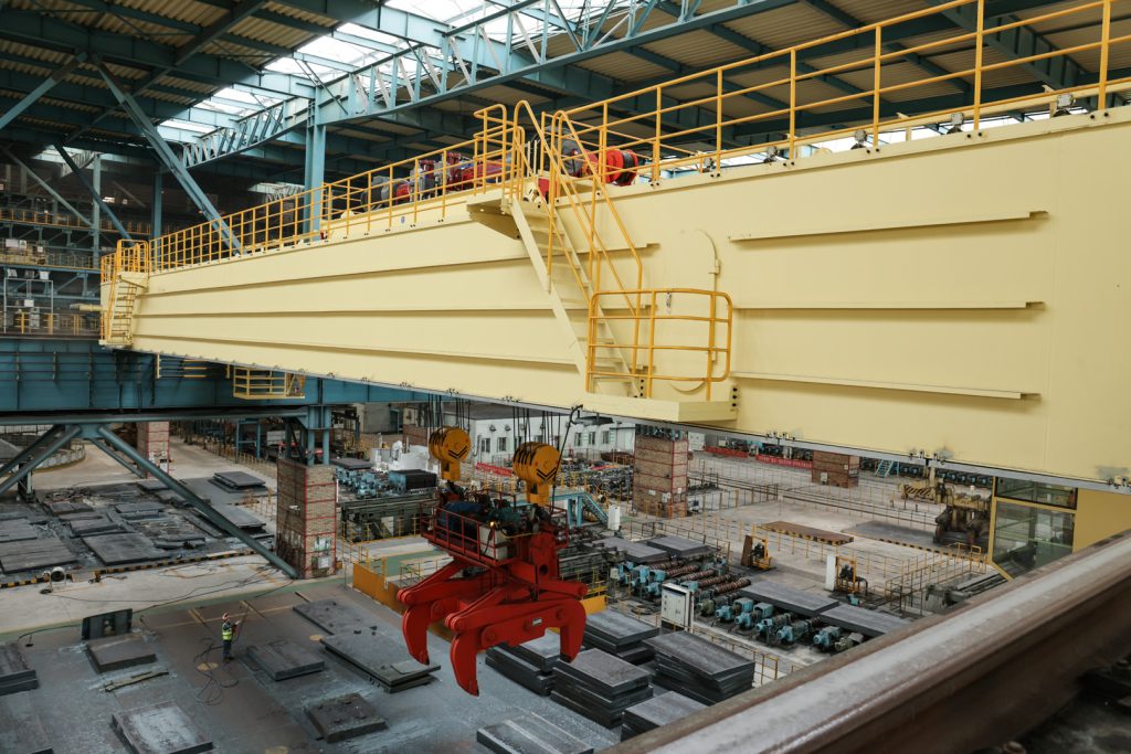 Slab clamp overhead crane installed above a steel slab handling bay