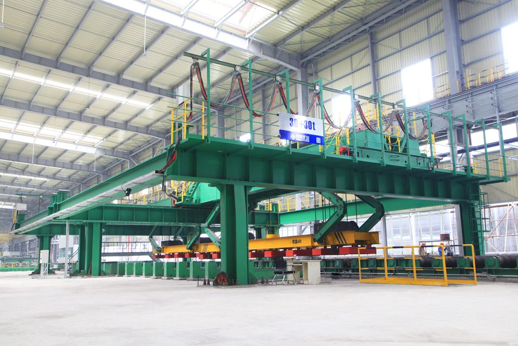 Steel handling gantry crane installed inside a manufacturing workshop