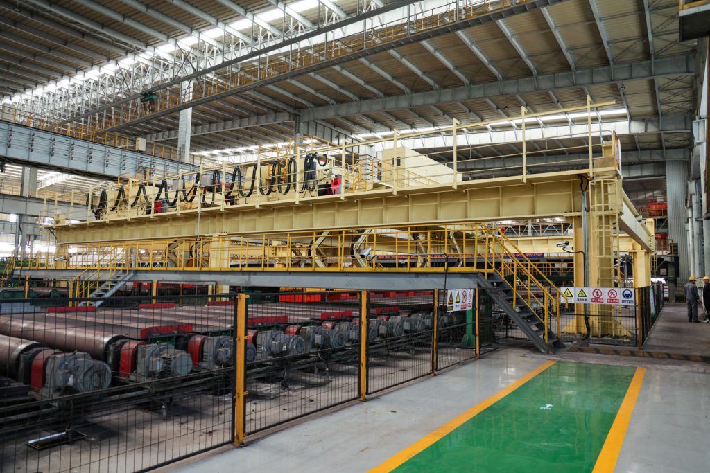 Slab clamp overhead crane installed above a steel slab handling bay